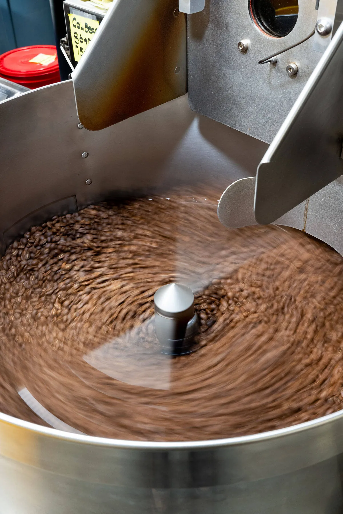 Freshly roasted beans turning in the stainless cooling tray of the Loquat roaster