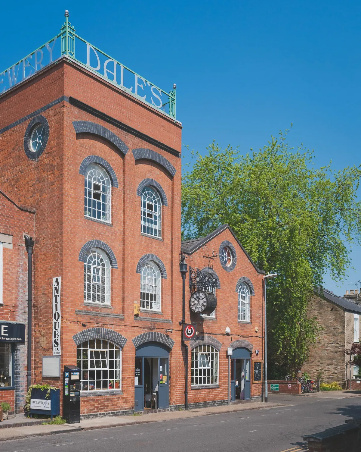 The red-brick tower of the former Dale’s Brewery in Cambridge, home of the original Hot Numbers coffee shop, under a blue sky