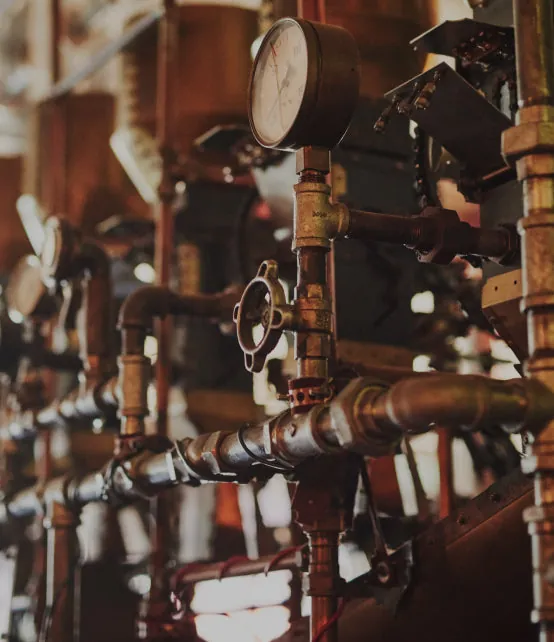 Brass pipework, valves and a pressure gauge inside the Truth café in Cape Town