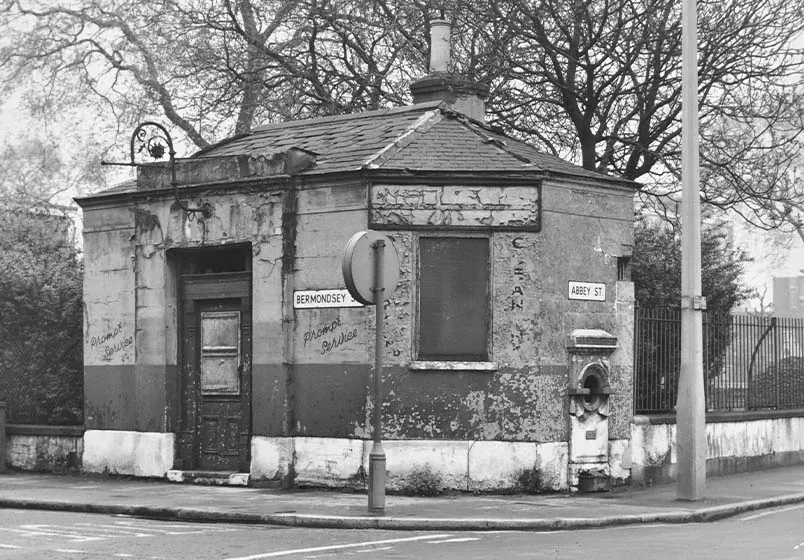 A black-and-white photograph of the derelict 19th-century watch house in Bermondsey before it became WatchHouse’s first café