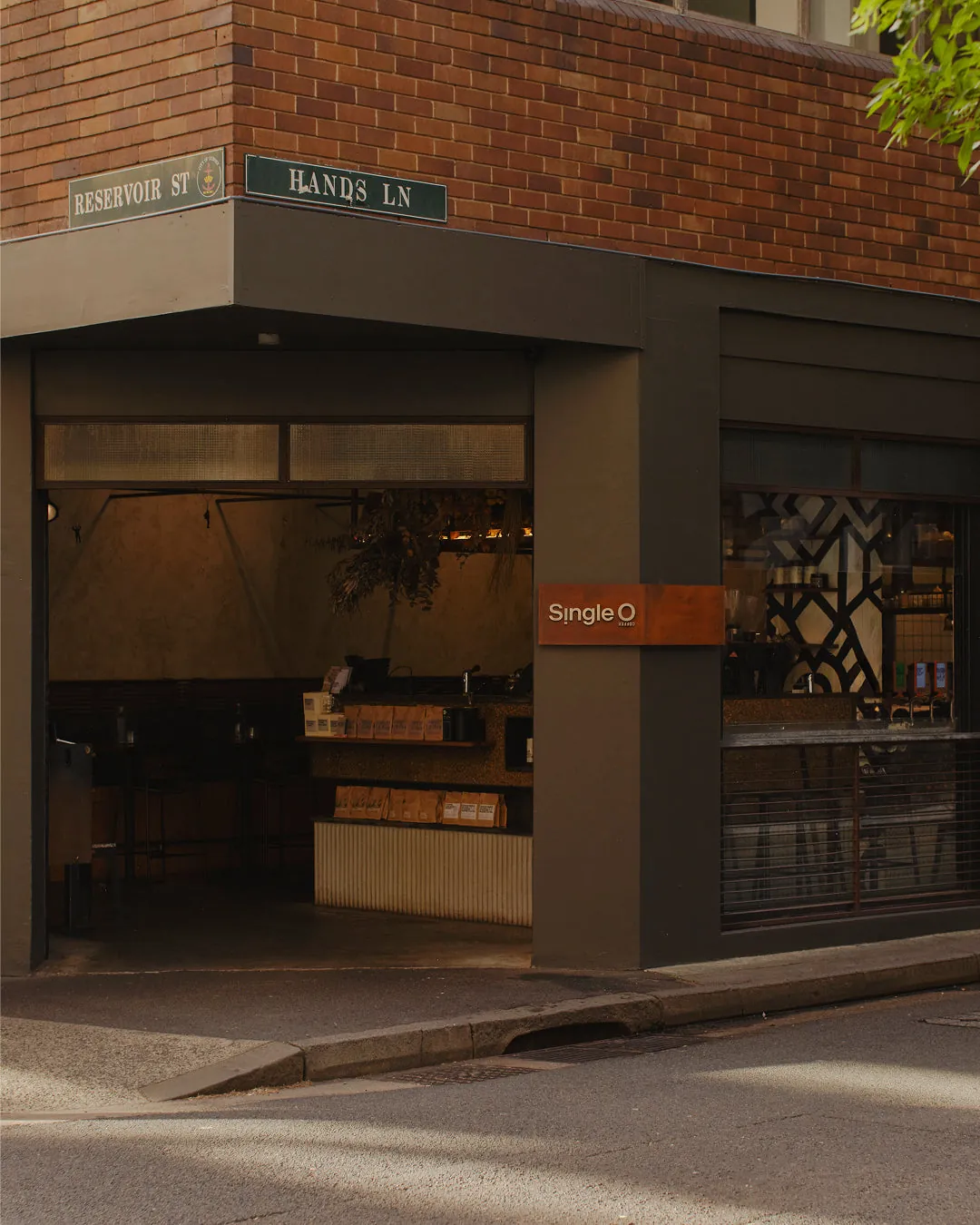 The corner shopfront of Single O in Surry Hills, with its copper sign and open doors onto the bar