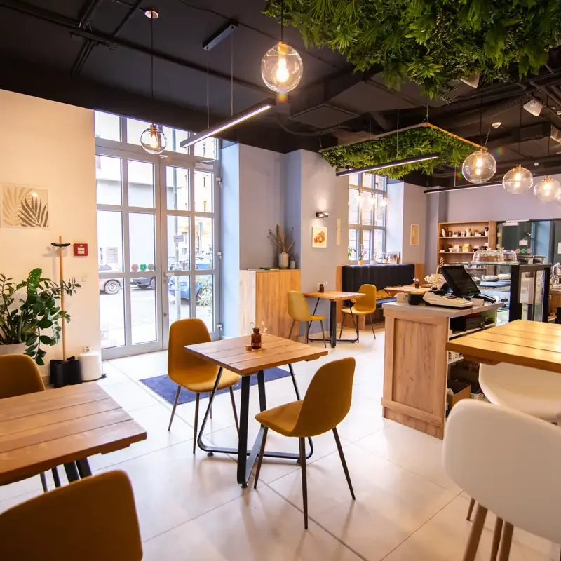 Inside Goosebumps Coffee Lab, with tables, the coffee counter and the entrance